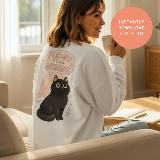 Cozy sweatshirt with printable PNG design “Follow Your Dreams Black Cat” – cute Halloween sublimation art for clothing, digital download.