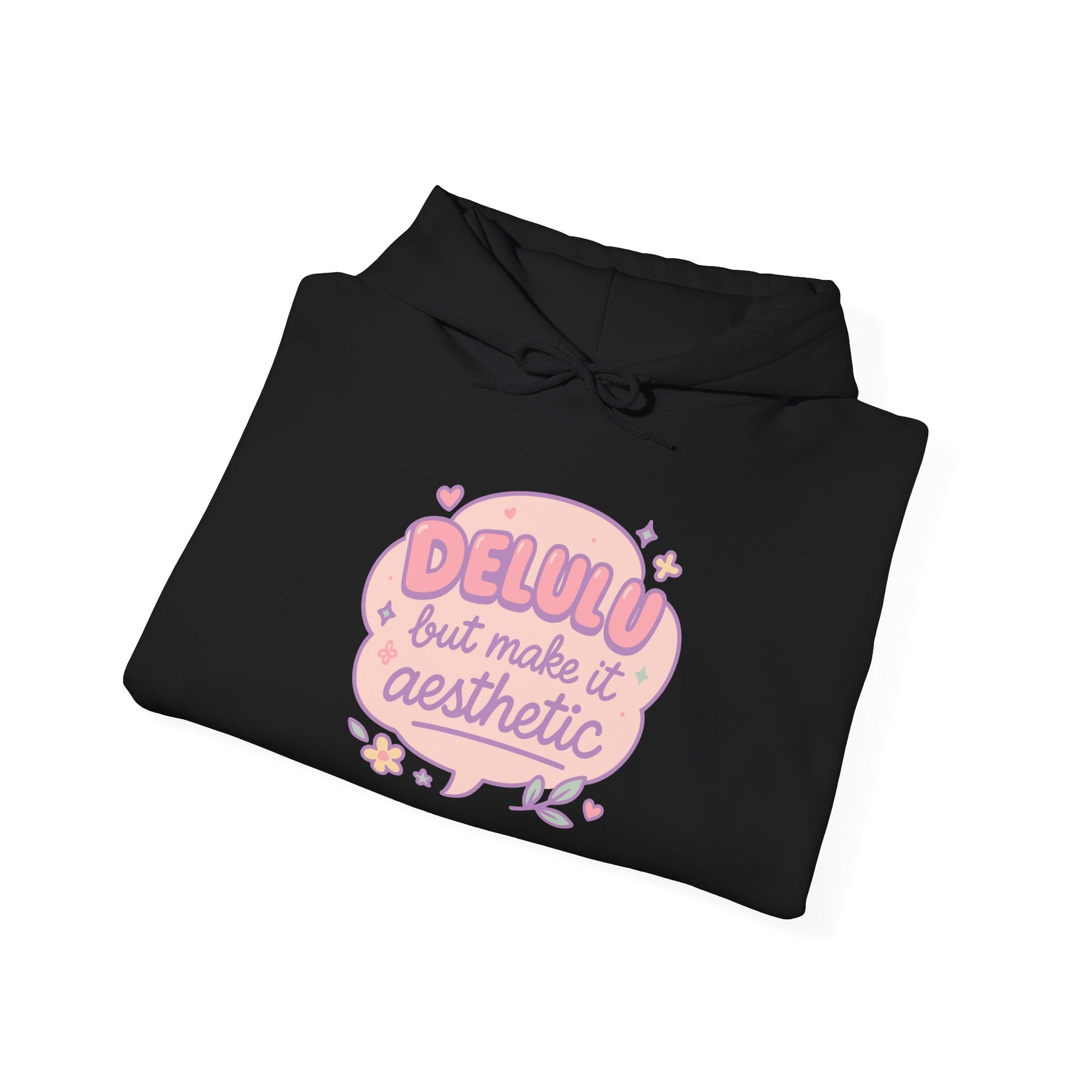 Folded black “Delulu but make it aesthetic” hoodie — RubiBloom pastel dreamy quote design with tiny hearts and stars, cozy cute sweatshirt for stylish dreamers.