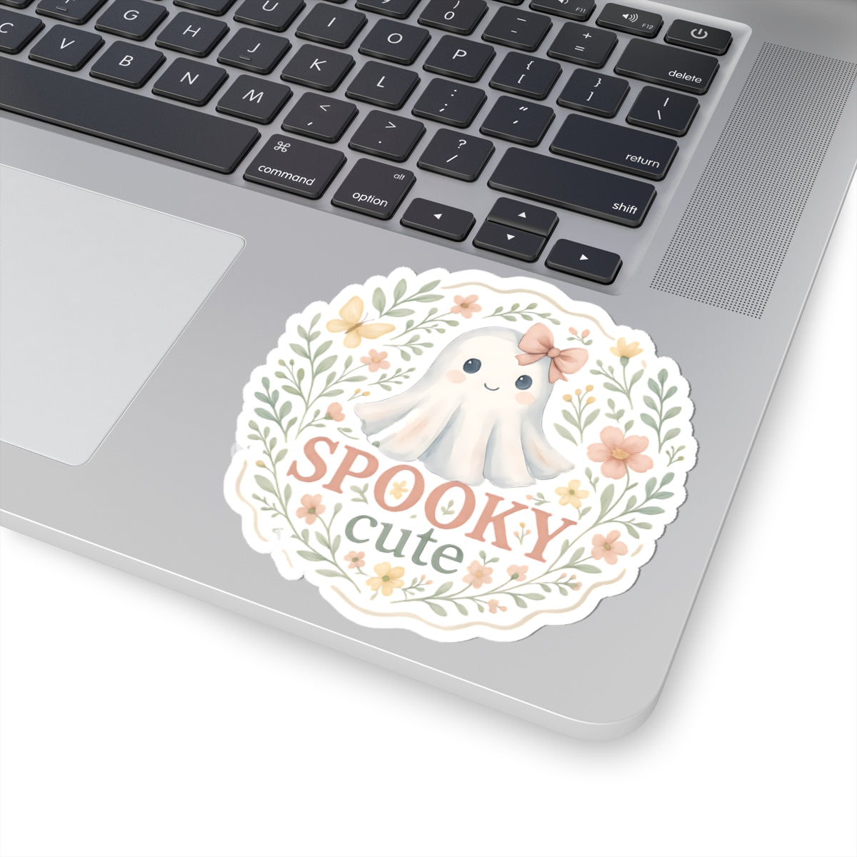 Cute ghost vinyl sticker with text Spooky Cute placed on laptop – dreamy pastel Halloween design for sticker collectors, planners, and cozy lifestyle lovers.