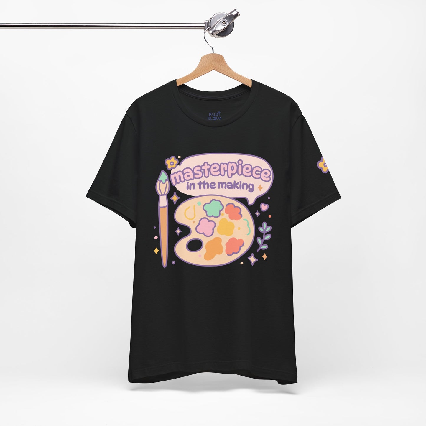 Black “Masterpiece in the Making” t-shirt with pastel print — dreamy artistic tee for creative souls, cozy outfit idea for art lovers.
