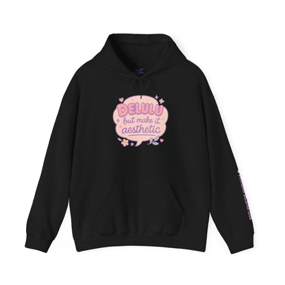 Black “Delulu but make it aesthetic” hoodie by RubiBloom — pastel pink print on dark cozy fabric, aesthetic quote hoodie for soft-core style lovers and comfy outfits.