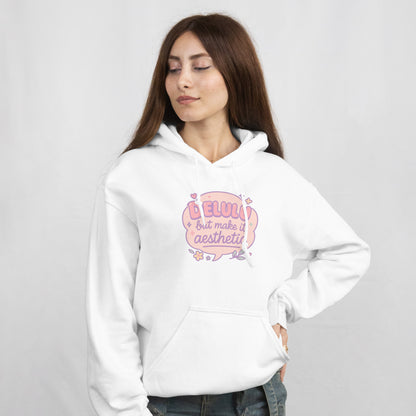 Woman wearing RubiBloom white hoodie with pastel quote “Delulu but make it aesthetic” — cute soft girl aesthetic sweatshirt with embroidered sleeve text “Daydream Believer Club”, cozy outfit for dreamers.