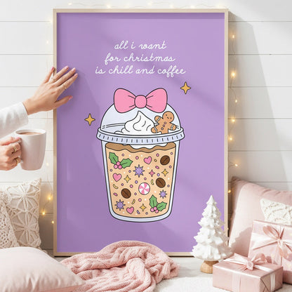 A framed art print featuring a Christmas-themed iced coffee cup with a gingerbread cookie and the text 'all i want for christmas is milk and coffee' on a lavender background, styled in a cozy bedroom setting with a pink blanket, pillows, and gift boxes.
